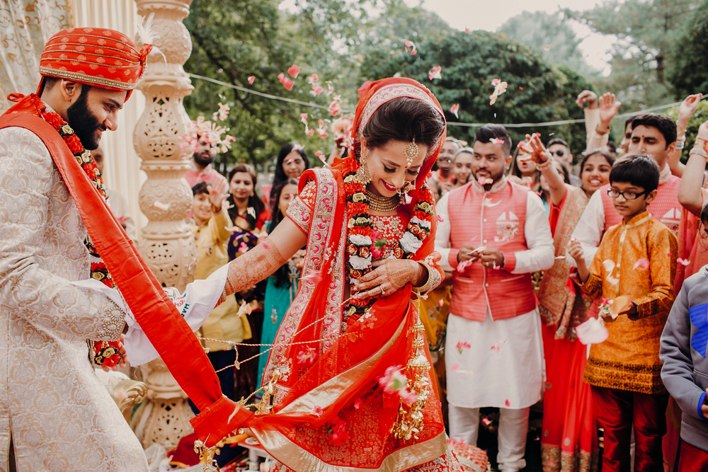 Couple at a vibrant Hindu wedding ceremony