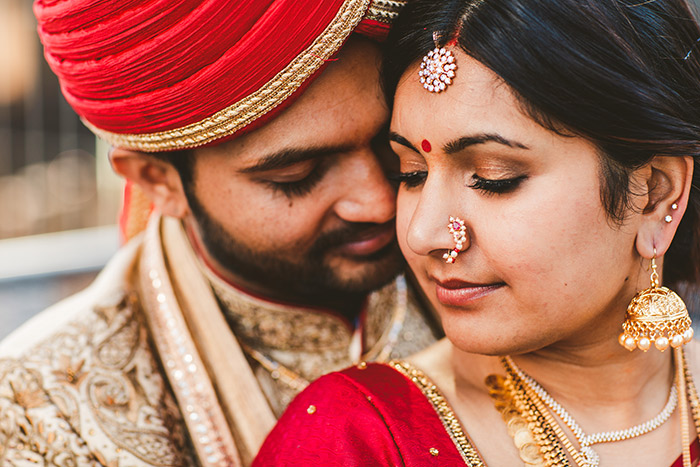 Indian couple exchanging garlands