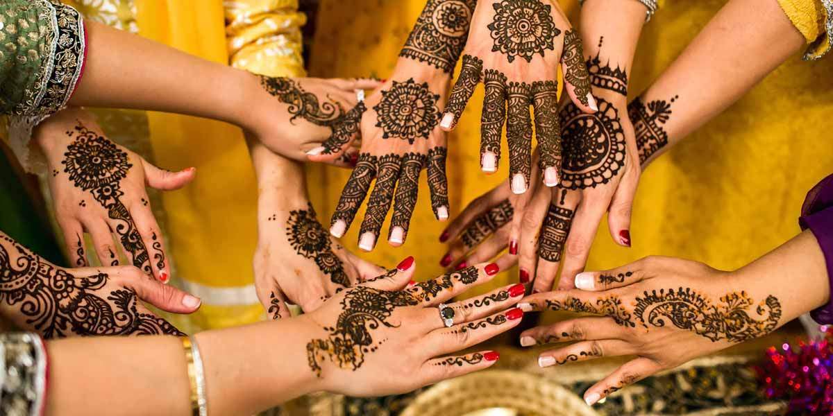 Mehndi ceremony: intricate designs on hands.