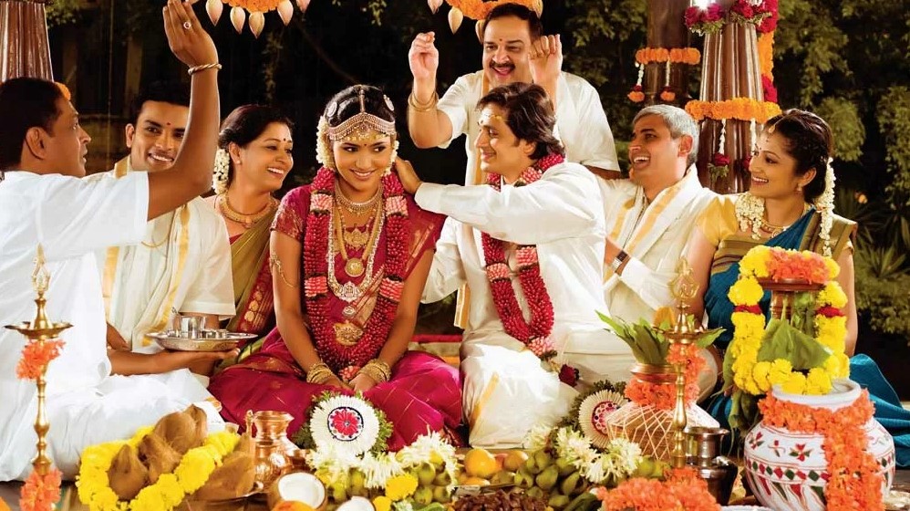 Couple exchanging garlands, South Indian wedding