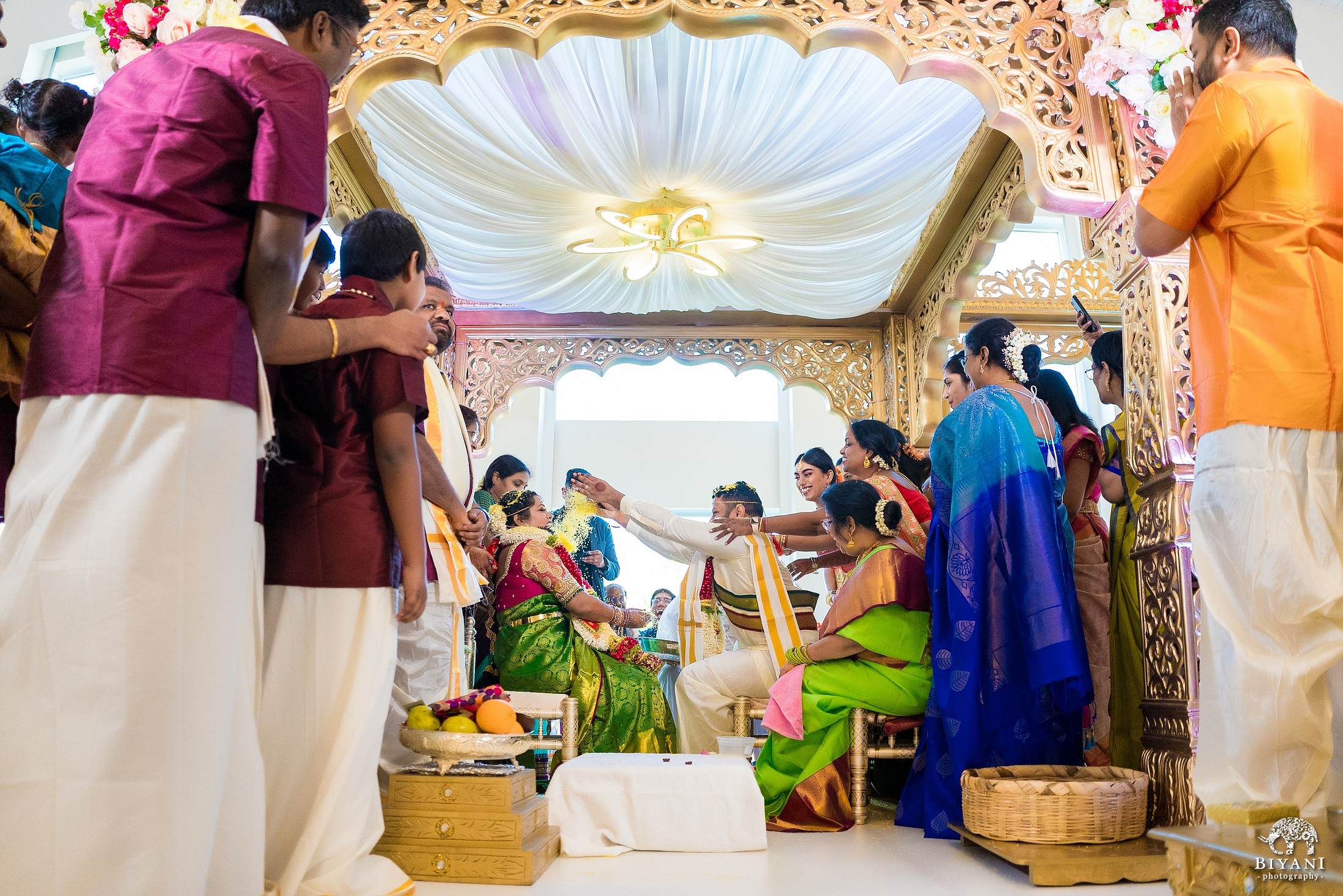 Bride in gold saree at South Indian wedding